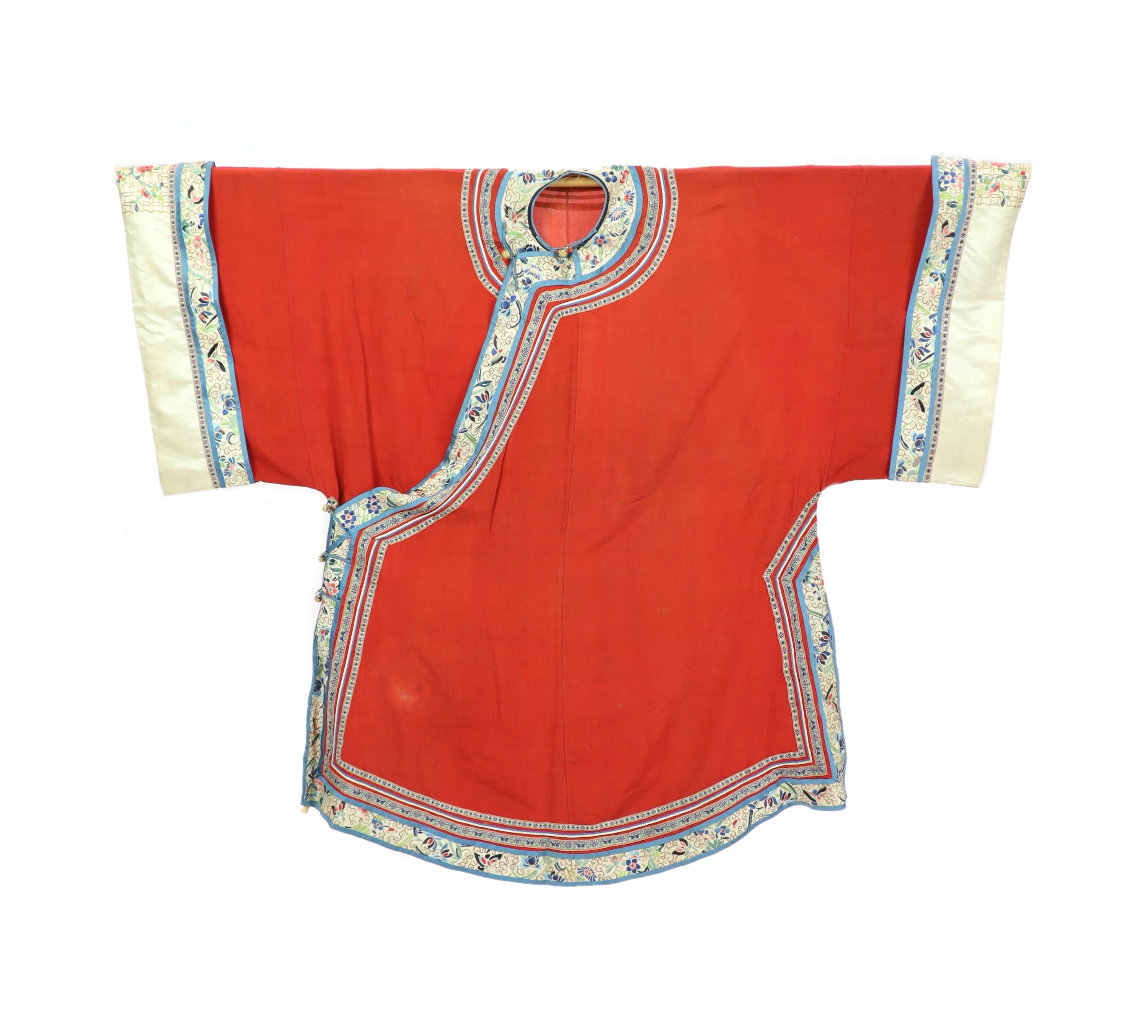 A Chinese red silk robe, late 19th century, 102cm drop